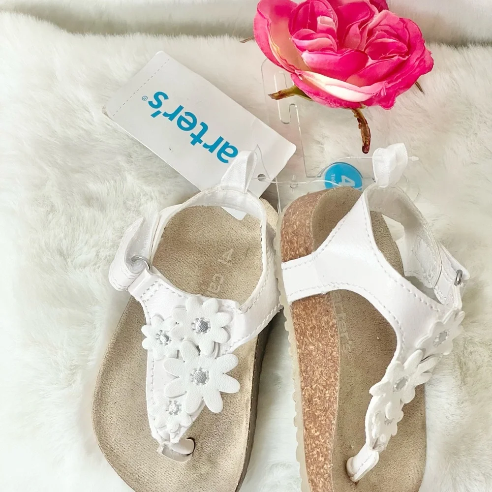 New with tags CARTER’S Toddler’s white Sandals with White Floral Design. Velcro